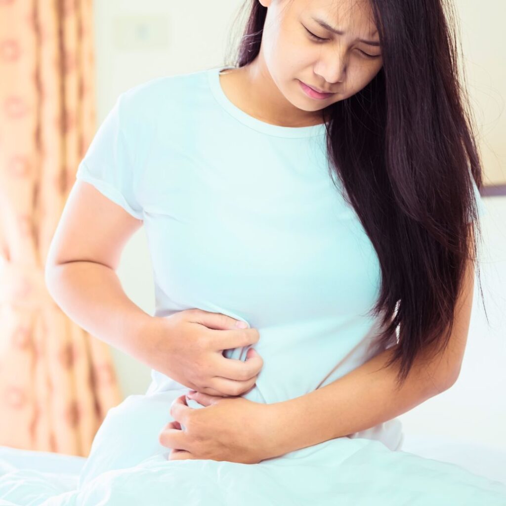 woman holding stomach